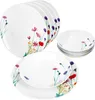 A set of white porcelain plates and bowls decorated with a floral pattern. Produktbild-Vorschau
