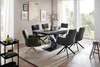 A dining room setting with a table and chairs. Produktbild-Vorschau