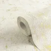 A roll of wallpaper with a textured white and gold pattern. Produktbild-Vorschau