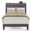 A bed with bedding and decorative items on the headboard, presented against a white background. Anteprima dell’immagine prodotto