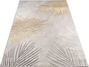 A rug with a leaf pattern is shown from a diagonal angle on a white background. Anteprima dell’immagine prodotto
