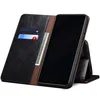 A black leather flip wallet case for a smartphone is shown open, with the phone inside and standing up. The case has slots for cards and cash. Produktbild-Vorschau