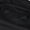 A close-up view of an open black bag, showing an internal zippered pocket. Náhled obrázku produktu