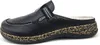 A single black clog shoe shown from the side against a white background. Anteprima dell’immagine prodotto