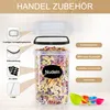A clear plastic food storage container filled with colorful pasta, with various features highlighted with text and icons. Produktbild-Vorschau