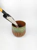 A scoop of perlite is being poured into a decorative pot. Voir les images du produit
