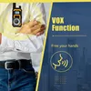 A person wearing a white shirt and blue jeans is shown with a walkie-talkie clipped to their shirt. The background features a cityscape and text highlighting the product's features. Náhled obrázku produktu