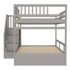 A gray bunk bed with stairs on the left, shown against a white background. Náhled obrázku produktu