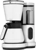 A white and silver filter coffee machine with a thermal carafe and a digital display is shown against a white background. Voir les images du produit
