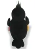 A plush toy raven is shown from the back, standing upright against a white background. It has a tuft of black hair on its head and is holding a striped object in one wing. Produktbild-Vorschau