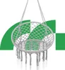A light gray woven hanging chair with tassels, suspended against a white background with green geometric shapes. Náhled obrázku produktu