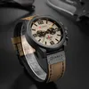 A close-up shot of a men's wristwatch with a leather strap, displayed on a stand against a dark background. Produktbild-Vorschau