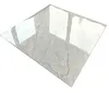 A single, glossy tile with a marble-like pattern is shown against a white background. Náhled obrázku produktu