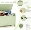 A collage of images showcasing a green toy chest with a crocodile design, featuring close-ups of its features and details. Voir les images du produit