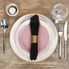 A table setting with plates, cutlery, a napkin, and a glass. Podgląd zdjęcia produktu
