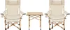 Two beige camping chairs and a small wooden table are arranged on a white background. Produktbild-Vorschau