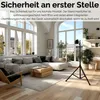 A modern living room with a sectional sofa, coffee table, and a floor heater on a tripod stand. Produktbild-Vorschau