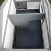Interior view of a pet hutch, showing the floor and a raised platform. Produktbild-Vorschau
