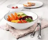 A close-up shot of a white dessert bowl filled with colorful salad ingredients, placed on a pink napkin. Anteprima dell’immagine prodotto
