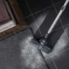 A vacuum cleaner head is shown cleaning a carpeted area adjacent to a tiled floor. Produktbild-Vorschau