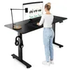 A woman is standing at a height-adjustable desk, using a computer. Náhľad obrázku produktu