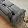 A close-up view of a gray sofa with side pockets and cushions. Voir les images du produit
