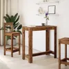 A bar table and stool set in a room with a plant and shelves. Anteprima dell’immagine prodotto