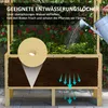 A raised garden bed with plants and soil, showing water drainage. Produktbild-Vorschau