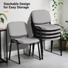A stack of chairs and one chair in front of them, with plants in the background. Náhľad obrázku produktu