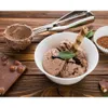 A chocolate ice cream scoop and bowl on a wooden table. Náhľad obrázku produktu