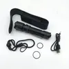 A black flashlight and its accessories are laid out on a white background. Produktbild-Vorschau