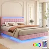 A pink upholstered bed with LED lighting in a bedroom setting. Podgląd zdjęcia produktu