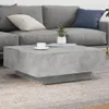 A modern living room scene with a gray sectional sofa and a concrete-look coffee table. Produktbild-Vorschau