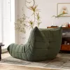 A green beanbag chair is placed on a striped rug in a living room setting. Produktbild-Vorschau