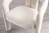 Close-up of a beige upholstered chair seat and armrest. Voir les images du produit