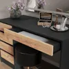 A vanity table with an open drawer, a stool, and decorative items. Produktbild-Vorschau