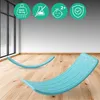 Two turquoise balance boards on a wooden floor in a room with large windows. Podgląd zdjęcia produktu