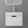 A close-up front view of a white wall-mounted bathroom vanity with a sink and a modern faucet. Anteprima dell’immagine prodotto