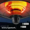 Close-up of a radiant heater with glowing heating elements against a dark background. Náhled obrázku produktu