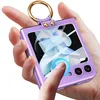 A hand holding a purple phone case with a gold ring attached. Produktbild-Vorschau