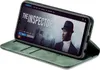 A green flip case for a smartphone, displaying a movie poster on the phone screen. Produktbild-Vorschau