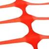 A close-up abstract view of orange plastic safety netting. Produktbild-Vorschau