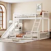 A white wooden bunk bed with a slide and ladder, set up in a bedroom with a window and a rug. Produktbild-Vorschau