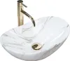 A white marble-patterned vessel sink with a gold faucet and drain. Anteprima dell’immagine prodotto