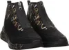 A pair of black ankle boots with a circular pattern and a central zipper. Produktbild-Vorschau