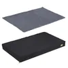 A top-down view of a gray blanket and a black dog bed. Produktbild-Vorschau