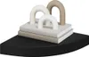 A corner shelf with decorative items on it. Produktbild-Vorschau