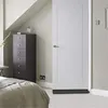A bedroom scene with a dresser and a door. Náhled obrázku produktu