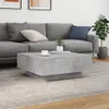 A modern living room scene with a grey sectional sofa and a concrete-effect coffee table. Produktbild-Vorschau