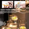 Close-up of floating LED candles in glass vases, with inset images showing how to activate and replace the battery. Produktbild-Vorschau